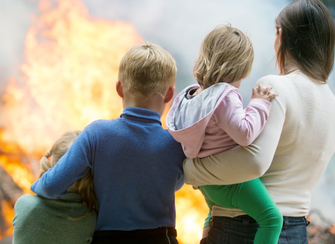 Power Surges Threaten Your Home - Family Watching Their Home Burn Down